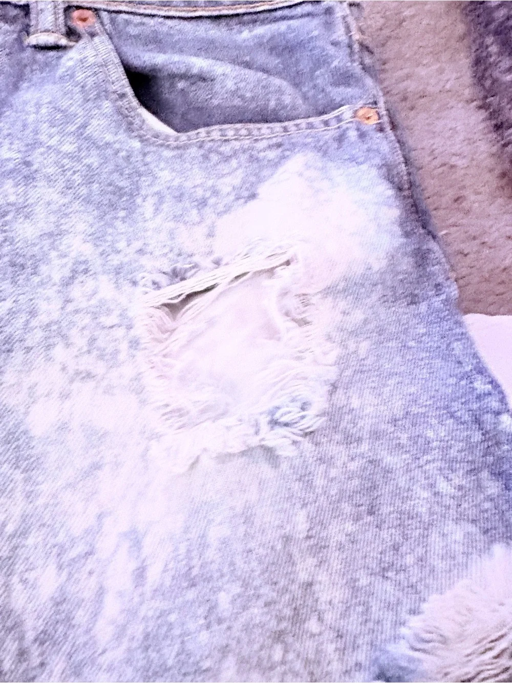 Levi's light blue denim shorts with frayed hem
